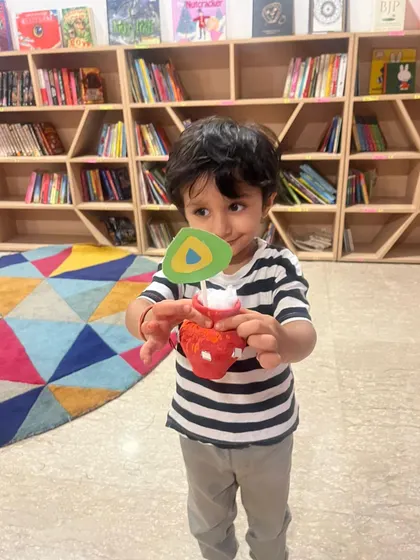 This little one is so focused on the matka craft he made. It’s wonderful to see them engaged in cultural activities from such a young age.