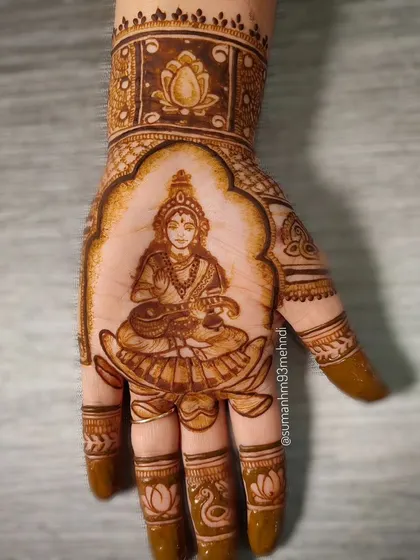 A detailed portrait of Goddess Saraswati, the goddess of knowledge and arts. This divine henna design is perfect for Navaratri or for anyone seeking blessings for their creative journey.