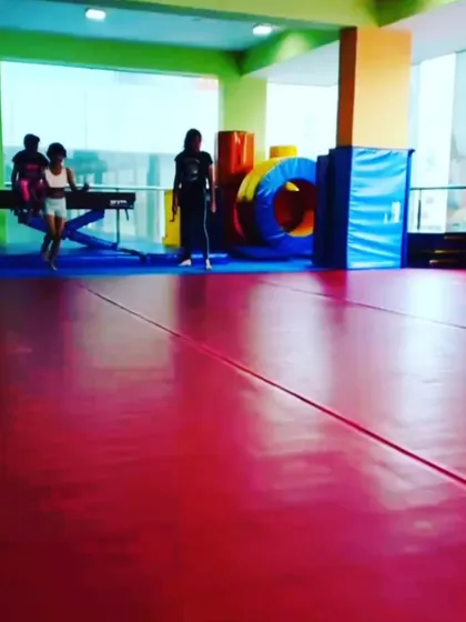 Our advanced grade schoolers practicing their skills. These action shots capture the dynamic movements and focus required for higher-level gymnastics.