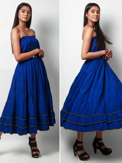 This image set shows a model in a royal blue strapless dress, capturing both a static pose and a dynamic shot with movement. This demonstrates the dress's flow and the model's ability to interact with the clothing.