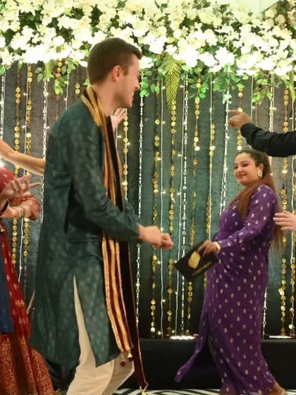 I specialize in bringing people together, no matter where they come from. Here I am, leading a dance segment at a vibrant Maharashtrian-German wedding, ensuring that guests from different cultures connect, laugh, and share the dance floor in a celebration of unity and love.