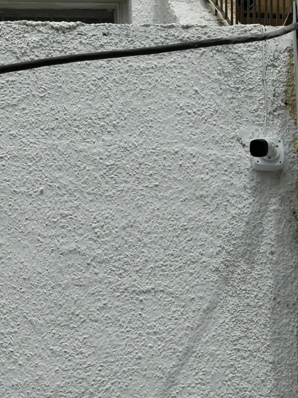 This camera is placed to monitor a blind spot along the side of a house. I identify and cover all potential vulnerabilities during my site survey.