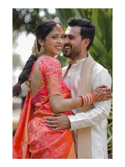 A happy and candid portrait of the couple at their Mehndi.