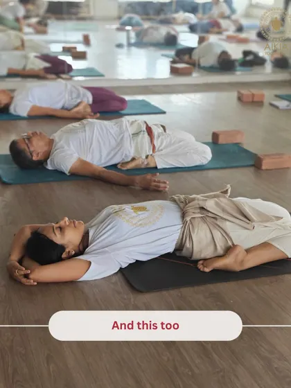 "And this too." Students rest in Supta Virasana, a deep restorative pose that is just as important as the more dynamic asanas in our holistic practice.