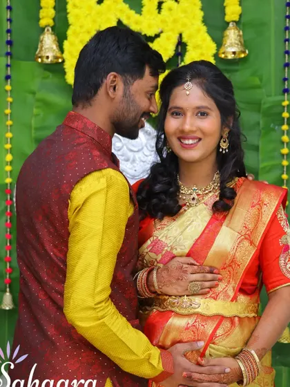 A happy couple at their traditional baby shower. We love creating the perfect backdrop with banana leaves and marigolds for these special, joyous family moments.