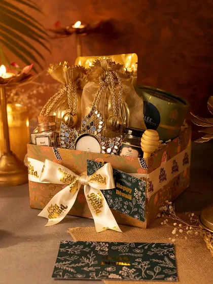 An open view of our hexagonal Diwali hamper, showcasing the curated items inside. We love playing with different packaging shapes and designs to keep things fresh.