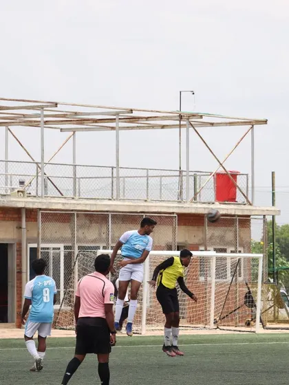 A player executing a header during a training match. Aerial ability is a crucial skill for both defenders and attackers, and it's a regular part of our practice sessions.