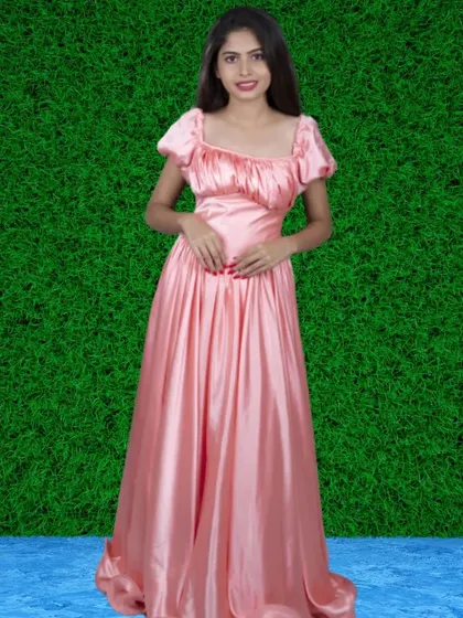 This peach-colored satin gown has a vintage feel with its puff sleeves and ruched bodice. It's a sweet and romantic option for your photoshoot.