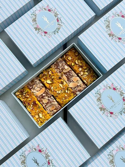 Welcome to the world, little one! These beautiful blue striped boxes, filled with our assorted bars, are perfect for sharing your happy news with family and friends.