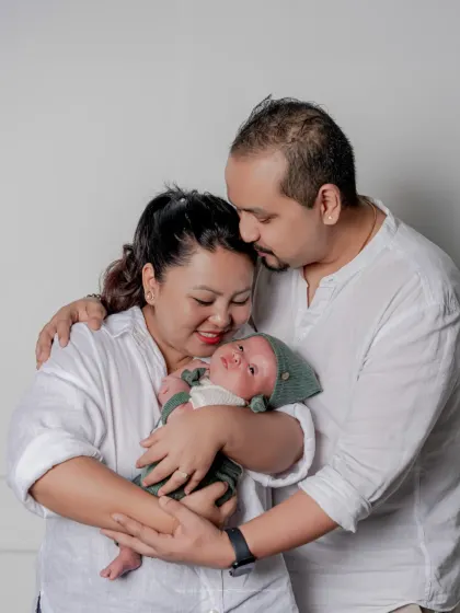 Three hearts beating as one. I love the way new parents look at their baby, and I strive to capture that look of pure love and wonder.