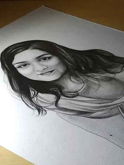 A close-up of the same portrait in progress. Capturing a likeness is a careful process of observation and shading.