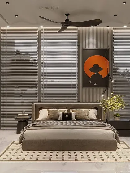 Another take on a bedroom with a window backdrop. Here, we used a darker color palette and dramatic artwork to create a cozy and modern feel, proving that even with a large window, you can design a very intimate space.