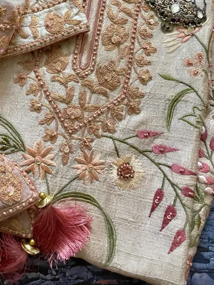 A flat-lay of the suit, showing the beautiful combination of embroidery and embellishments.
