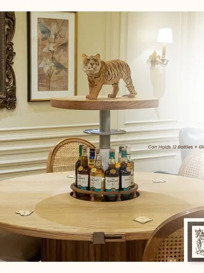 Here you can see the 'Bluff Boldly' table in action. The automated center rises to reveal a bar that holds up to 12 bottles and glasses, blending the function of a dining table with the excitement of a home bar.