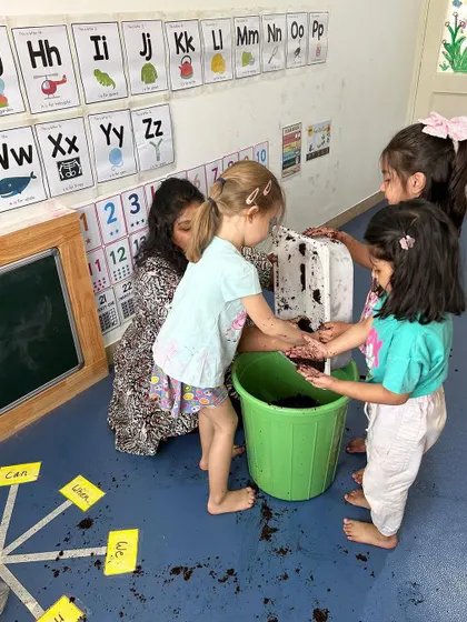 Our terrace gardening project begins with exploring the soil. Children feel the texture of the earth, a sensory experience that connects them directly to nature and the food-growing process.