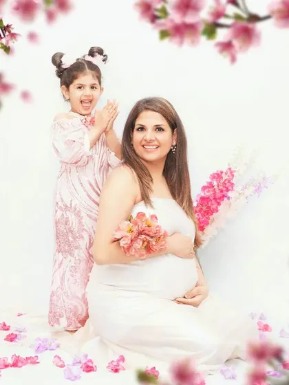 A joyful family maternity session celebrating the upcoming arrival with an older sibling. These moments are so special, capturing the excitement of the whole family in a fun, lighthearted setting.