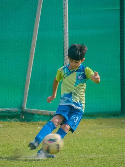 A player connects with the ball for a shot, a moment of opportunity in a fast-paced game.