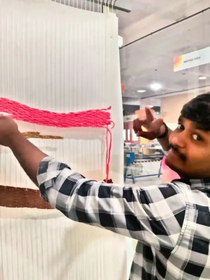 A fun shot of my team member posing while working on the tapestry. We always have a good time creating.