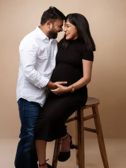 Soft giggles and subtle elegance. This portrait captures a promise of love, partnership, and the little miracle they’re waiting to meet.