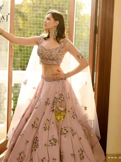Another angle of the pink floral crop top lehenga, showcasing its intricate details and modern design.