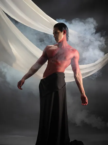 A powerful, contorted pose that highlights the artistic and performance aspect of this body paint project.