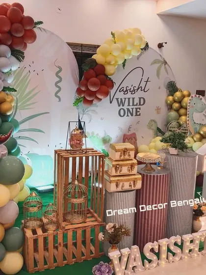 Another angle of the 'Wild One' dinosaur party, showing the full arrangement of props and balloons.