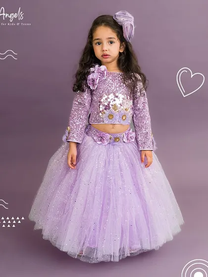 This full view of the lilac shimmer lehenga shows the sparkling fabric and comfortable crop top design.