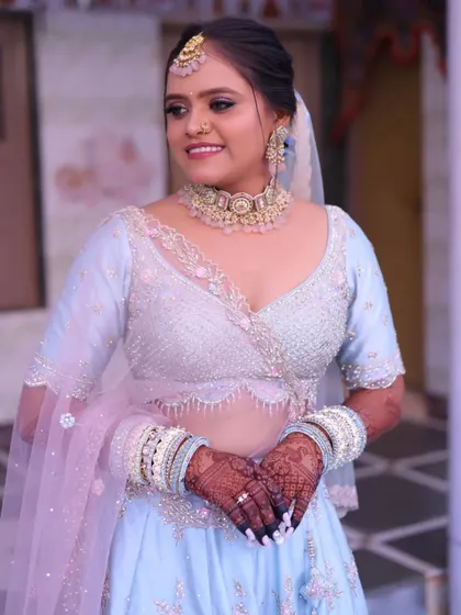 A candid moment of the Gujarati bride. Her makeup is soft and pretty, letting her natural beauty and happiness take center stage.