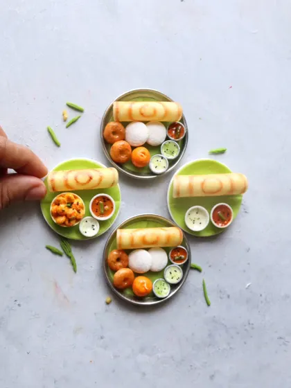 A collection of South Indian breakfast miniatures ready to be turned into magnets or keychains. These make for wonderful, personalized gifts that celebrate a love for food.