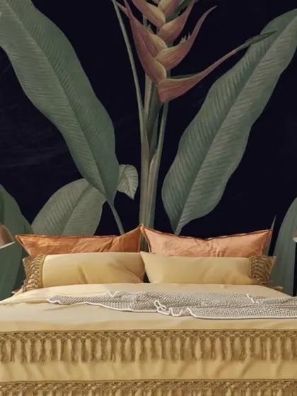 A close-up of a dark, dramatic tropical flower mural behind a bed, creating a luxurious and intimate bedroom setting.