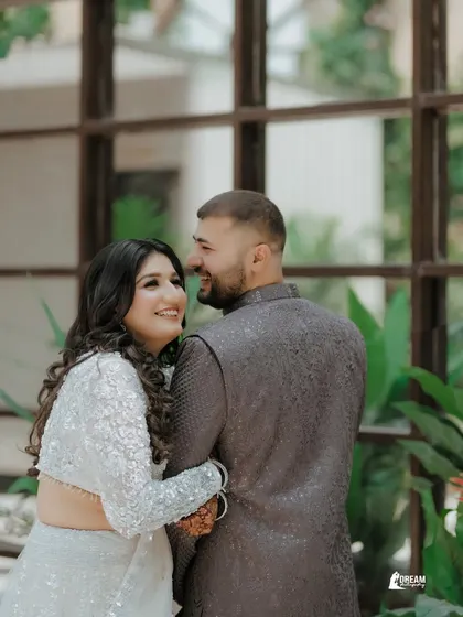 A happy, candid moment from a ring ceremony. The natural smiles and loving glances are what make these event photos so special.