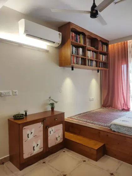 The complete reading corner, with the floating bookshelf, the crane-themed cabinet, and the extended platform bed creating a cozy and eclectic space.