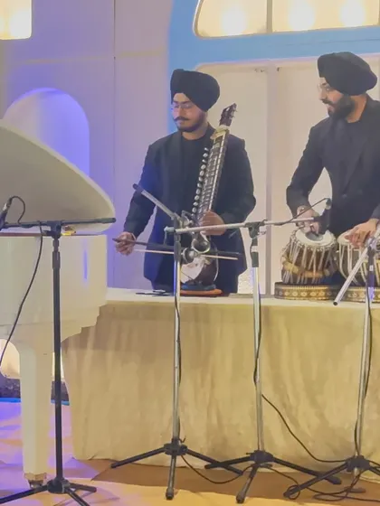 Performing alongside a tarshehnai player during an elegant event. This duo is perfect for adding a touch of classical grace.