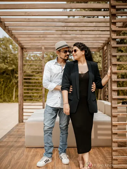 A stylish pre-wedding look. The makeup is sophisticated and polished, perfect for a modern couple's shoot.
