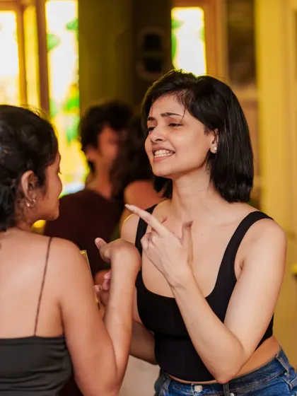 Friends catching up and enjoying the vibe. The social atmosphere at Monkey Bar is just as important as the music.