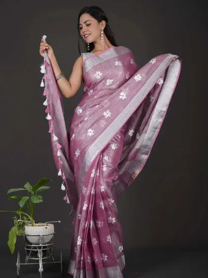 Enjoy the beauty of linen with the ease of my 1-Minute Saree. This mauve linen saree features delicate white floral embroidery and is pre-stitched to perfection. It’s a wonderful choice for daytime events or casual outings.