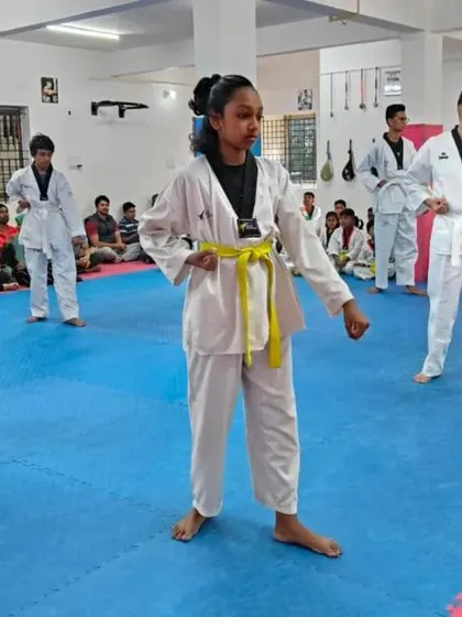 A group of yellow belts practicing their form.