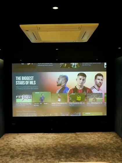 A duplicate of 201, this shot emphasizes the clean, uncluttered front of the room, where the focus is entirely on the massive screen and immersive sound.