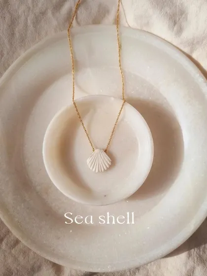 The 'saṅkha' Howlite Shell Pendant, a simple and beautiful piece for finding calm.