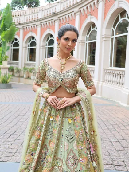 A Mehendi or Carnival event calls for a fun and vibrant look. I designed this playful style with creative eye makeup and a festive green lehenga, ensuring the bride stands out and feels amazing during her daytime celebrations.
