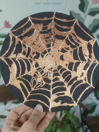 A spooky and intricate spiderweb design created with gold foil. The possibilities are endless!
