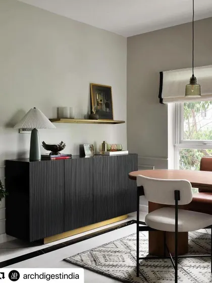 Another angle of the dining space, highlighting the contrast between our dark sideboard and the lighter dining chairs and table.