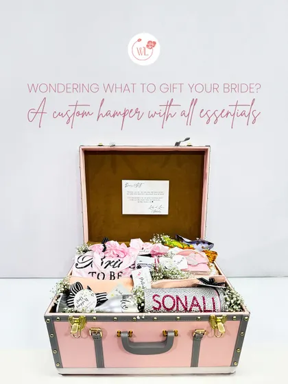 Every bride deserves to be pampered. This vintage-style trunk is filled to the brim with custom essentials, from personalized robes and tumblers to keepsakes, making it the ultimate 'bride-to-be' treasure chest.