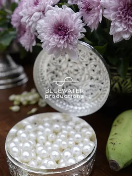 A close-up of a silver box filled with pearls, a beautiful and luxurious detail.