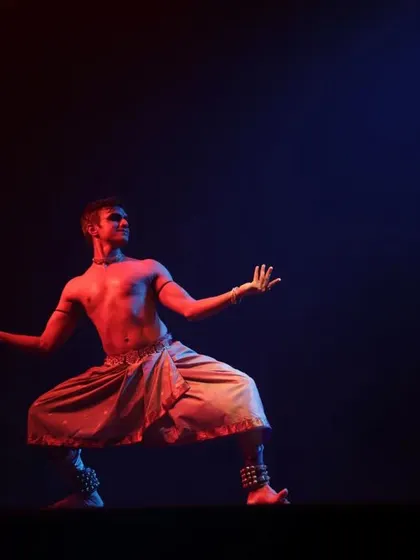 A powerful stance from my 'Shivanjali' performance. The red and blue lighting creates a dynamic and otherworldly atmosphere.