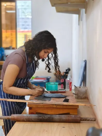 An instructor is deeply focused on her work, demonstrating the dedication and passion that we bring to our craft and our teaching.