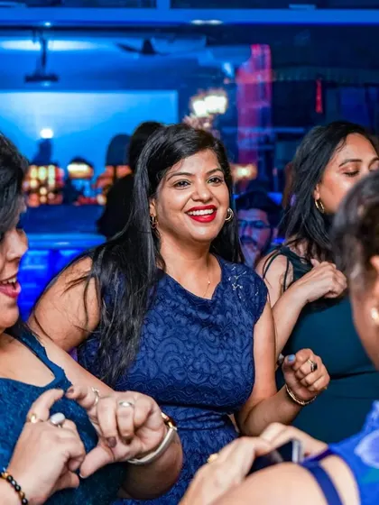 The party never stops here. This is a typical scene on a weekend night, with guests dancing and enjoying the electric vibe.