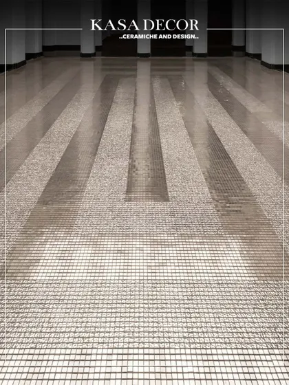 Platinum mosaics installed under a skylight at the Seema Gujral flagship store. The tiles create a delicate, concentric rhythm, playing with reflection and light to evoke a powerful emotion.