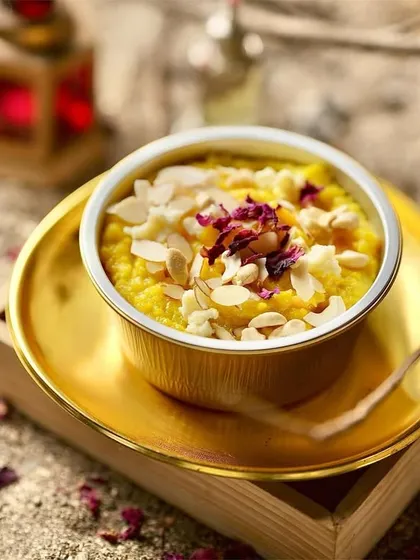 My Pineapple Soufflé is light, airy, and melts in your mouth. This delicate dessert is topped with almond flakes and dried rose petals for a touch of elegance.