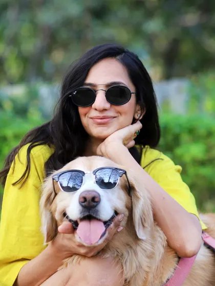 Twinning in sunglasses! This fun shot of Anjana and her cool dog Abby shows off the playful side of your relationship.